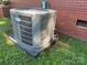 Image shows the home's air conditioner unit outside, ready for the summer heat on a well maintained lawn at 708 East St # 89, Albemarle, NC 28001