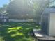 Spacious backyard featuring a storage shed and lush lawn at 708 East St # 89, Albemarle, NC 28001