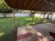 Spacious backyard with a wooden patio cover and storage shed at 708 East St # 89, Albemarle, NC 28001