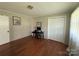 Spacious bedroom with hardwood floors, neutral walls and a desk by the window at 708 East St # 89, Albemarle, NC 28001