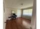 Bedroom with hardwood floors, neutral walls and a desk by the window at 708 East St # 89, Albemarle, NC 28001