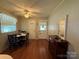 Inviting dining space with a cozy table setup, natural lighting, and convenient access to laundry area at 708 East St # 89, Albemarle, NC 28001