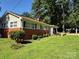 Inviting home features brick and vinyl siding, complemented by a well-manicured lawn at 708 East St # 89, Albemarle, NC 28001