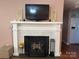 Close-up of the fireplace with a white painted brick surround, hearth and mantle at 708 East St # 89, Albemarle, NC 28001