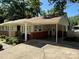 Charming home featuring a covered porch and carport with brick and siding exterior at 708 East St # 89, Albemarle, NC 28001