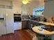 Functional kitchen featuring white appliances, ample cabinet space, and modern countertops at 708 East St # 89, Albemarle, NC 28001