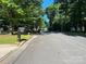 Picturesque street with mature trees and well-maintained properties in a tranquil residential area at 708 East St # 89, Albemarle, NC 28001