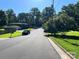 Quiet street view showcasing mature trees and the house, offering a glimpse of the peaceful neighborhood at 708 East St # 89, Albemarle, NC 28001