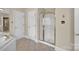 Bathroom featuring a glass shower and a sink with white cabinets at 803 Woodmoore Ln, Kannapolis, NC 28081