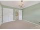 Bedroom featuring carpet, neutral paint, access door and closet at 803 Woodmoore Ln, Kannapolis, NC 28081