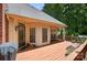 Spacious wood deck featuring outdoor seating, a grill, and lush backyard views at 803 Woodmoore Ln, Kannapolis, NC 28081