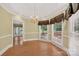 Formal dining room featuring hardwood floors, chandelier, and lots of natural light at 803 Woodmoore Ln, Kannapolis, NC 28081