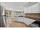 Kitchen with stainless steel appliances, tile floors, and breakfast nook with natural lighting at 803 Woodmoore Ln, Kannapolis, NC 28081