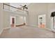 Expansive living room with hardwood floors, multiple doorways, and a view of the upper level at 803 Woodmoore Ln, Kannapolis, NC 28081