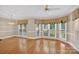 Spacious living area with tile and wood flooring and bay windows bringing in natural light at 803 Woodmoore Ln, Kannapolis, NC 28081