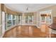 Inviting breakfast nook with wood floors and lots of natural light from surrounding windows at 803 Woodmoore Ln, Kannapolis, NC 28081