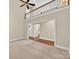 Spacious living room with a vaulted ceiling, ceiling fan, and view of the upper level at 803 Woodmoore Ln, Kannapolis, NC 28081