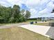 Suburban front yard with green grass, a concrete driveway, and blue trash cans at 835 Windage Way, Pineville, NC 28134