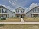 Charming two-story home with stylish brick accents and inviting landscaped front yard at 835 Windage Way, Pineville, NC 28134