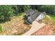 Aerial view of new construction home with driveway and spacious side yard at 8680 Sherrills Ford Rd, Sherrills Ford, NC 28673