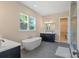 Luxurious bathroom featuring a freestanding tub, dual vanities, and a glass-enclosed shower at 8680 Sherrills Ford Rd, Sherrills Ford, NC 28673
