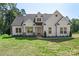 Well-maintained home featuring meticulous architecture with lush green grass and trimmed landscaping at 8680 Sherrills Ford Rd, Sherrills Ford, NC 28673