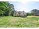 New home features architectural details and large front yard at 8680 Sherrills Ford Rd, Sherrills Ford, NC 28673