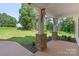 Inviting porch with stone base columns and a view of a manicured lawn at 8680 Sherrills Ford Rd, Sherrills Ford, NC 28673