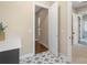 Hallway featuring patterned tile floors and doorways leading to various rooms at 8680 Sherrills Ford Rd, Sherrills Ford, NC 28673