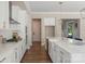Bright kitchen with white cabinets, stainless steel appliances, and a view into an adjoining pantry at 8680 Sherrills Ford Rd, Sherrills Ford, NC 28673