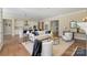 Bright, open-concept living room flowing into a modern kitchen with island seating at 8680 Sherrills Ford Rd, Sherrills Ford, NC 28673