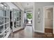 Welcoming foyer with hardwood floors, office view, and modern decor at 8702 Aspinwall Dr, Charlotte, NC 28216
