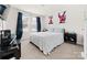 Bedroom with large windows and curtains has plush neutral carpeting and is freshly painted at 9025 Henry Thoreau Rd, Charlotte, NC 28214