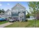 Charming two-story home with a well-manicured lawn and a single-car attached garage in a modern neighborhood at 9025 Henry Thoreau Rd, Charlotte, NC 28214
