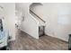 Hallway with views of the staircase, blending functionality with neutral decor at 9025 Henry Thoreau Rd, Charlotte, NC 28214