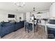 Open concept living space with modern finishes, seamlessly connecting the kitchen, dining, and living areas at 9025 Henry Thoreau Rd, Charlotte, NC 28214
