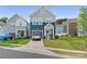 Charming two-story home with a well-manicured lawn and a single-car attached garage in a modern neighborhood at 9025 Henry Thoreau Rd, Charlotte, NC 28214