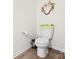 Cozy toilet room enhanced with decorative wreath and greenery at 9025 Henry Thoreau Rd, Charlotte, NC 28214