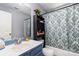 Bathroom features a single sink vanity and a shower/tub combo with curtain at 9520 Marshbrooke Rd, Matthews, NC 28105