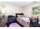 Bright bedroom with a wooden bed frame and plenty of natural light at 9520 Marshbrooke Rd, Matthews, NC 28105