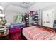 Bedroom with two beds, overhead fan and wire rack storage at 9520 Marshbrooke Rd, Matthews, NC 28105