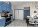 Efficient kitchen featuring blue cabinets, modern appliances, and plenty of storage at 9520 Marshbrooke Rd, Matthews, NC 28105