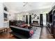 Spacious living room with fireplace, ceiling fan, and sliding glass door to outdoor space at 9520 Marshbrooke Rd, Matthews, NC 28105