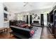 Spacious living room with fireplace, ceiling fan, and sliding glass door to outdoor space at 9520 Marshbrooke Rd, Matthews, NC 28105