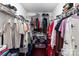 Walk-in closet with wire shelving filled with neatly arranged clothing at 9520 Marshbrooke Rd, Matthews, NC 28105