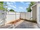 Cozy backyard features a privacy fence, a small garden, and a concrete patio at 9664 Littleleaf Dr, Charlotte, NC 28215