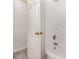 Bathroom with a shower and tub, white trim and a white shower head at 9664 Littleleaf Dr, Charlotte, NC 28215