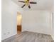 Bedroom featuring a ceiling fan, new floors, and access to the ensuite bathroom at 9664 Littleleaf Dr, Charlotte, NC 28215