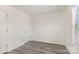 Bedroom with light gray floors, a double door closet, and bright natural light from a window at 9664 Littleleaf Dr, Charlotte, NC 28215