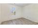 Bedroom with a light gray floors and bright natural light from a large window at 9664 Littleleaf Dr, Charlotte, NC 28215